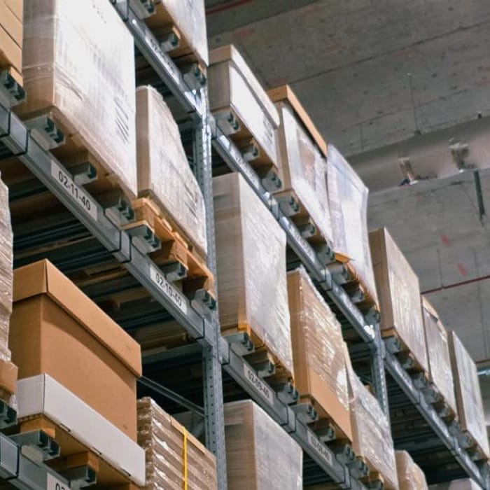 Cartons of finished goods stacked on warehouse racking